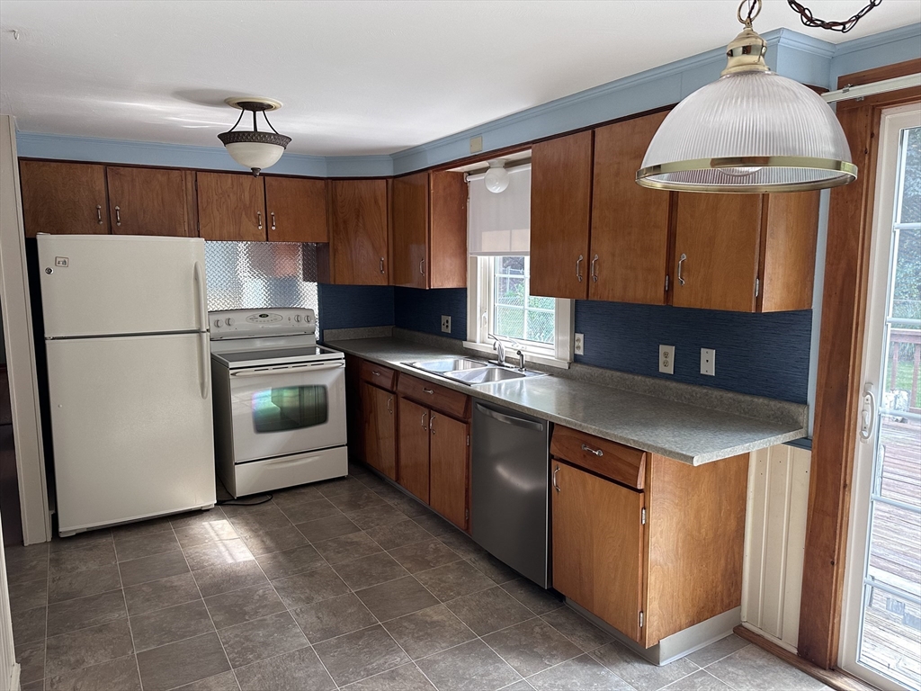 37 Bretton Road Springfield, MA 01119 - Photo 2 of 36 a kitchen with stainless steel appliances granite countertop a sink a stove and a refrigerator