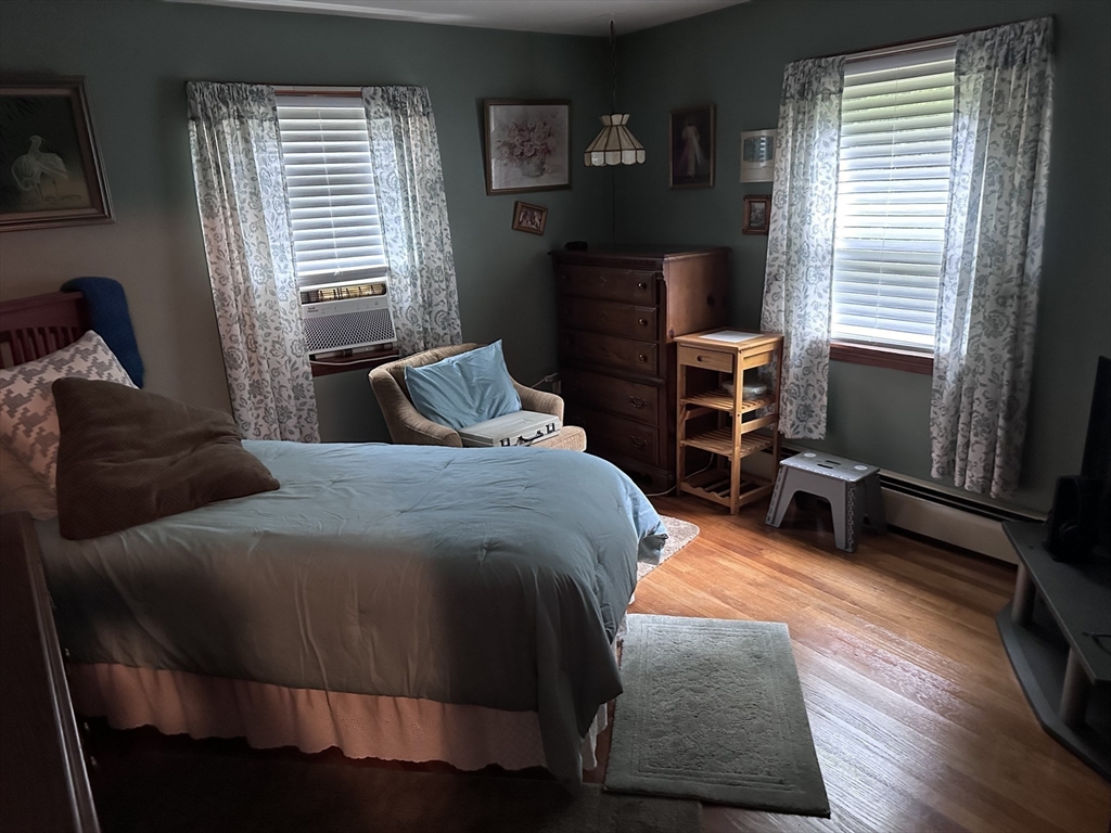 37 Bretton Road Springfield, MA 01119 - Photo 26 of 36 a bedroom with a bed and a flat tv screen on dresser