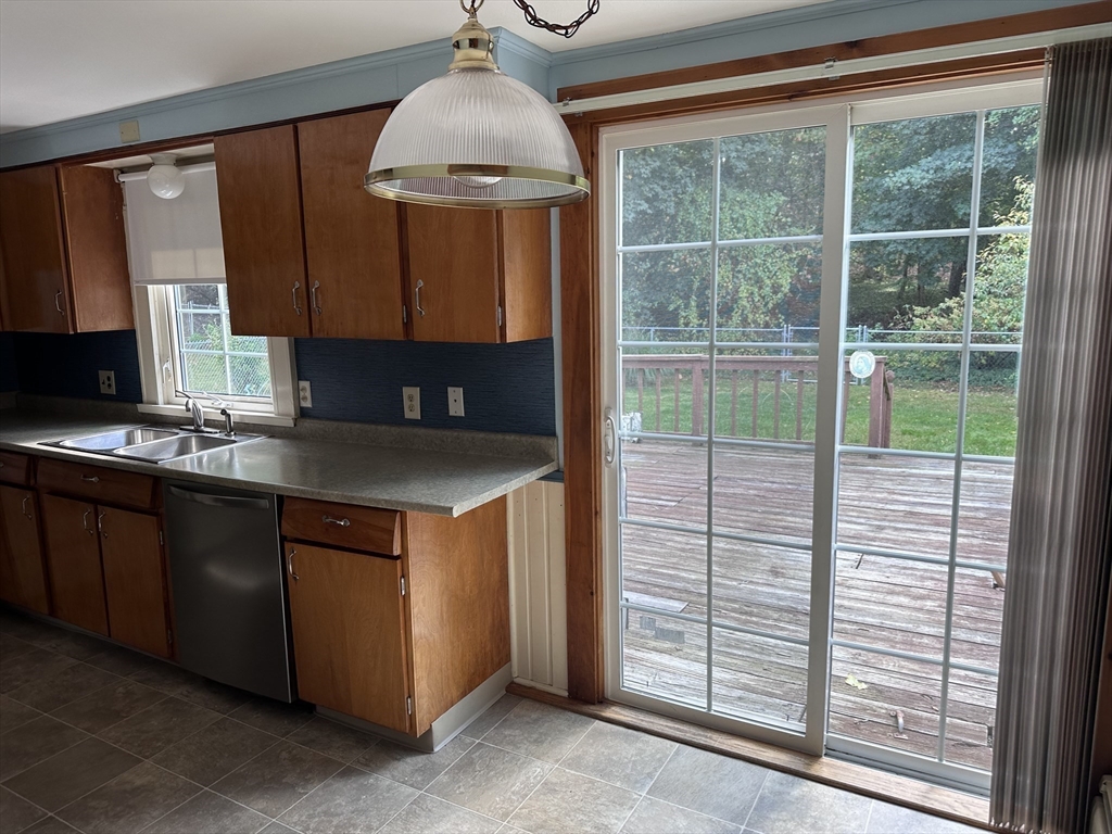 37 Bretton Road Springfield, MA 01119 - Photo 29 of 36 a kitchen with kitchen island a large window a sink and a counter top space