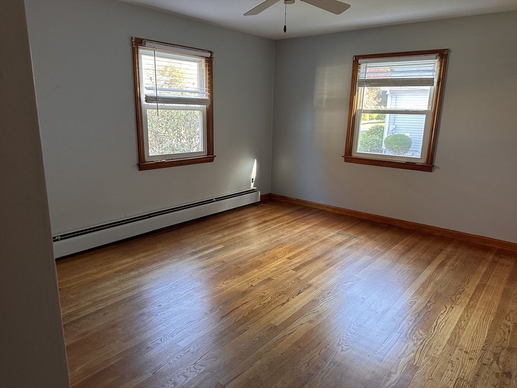 37 Bretton Road Springfield, MA 01119 - Photo 31 of 36 a view of an empty room with wooden floor and a window