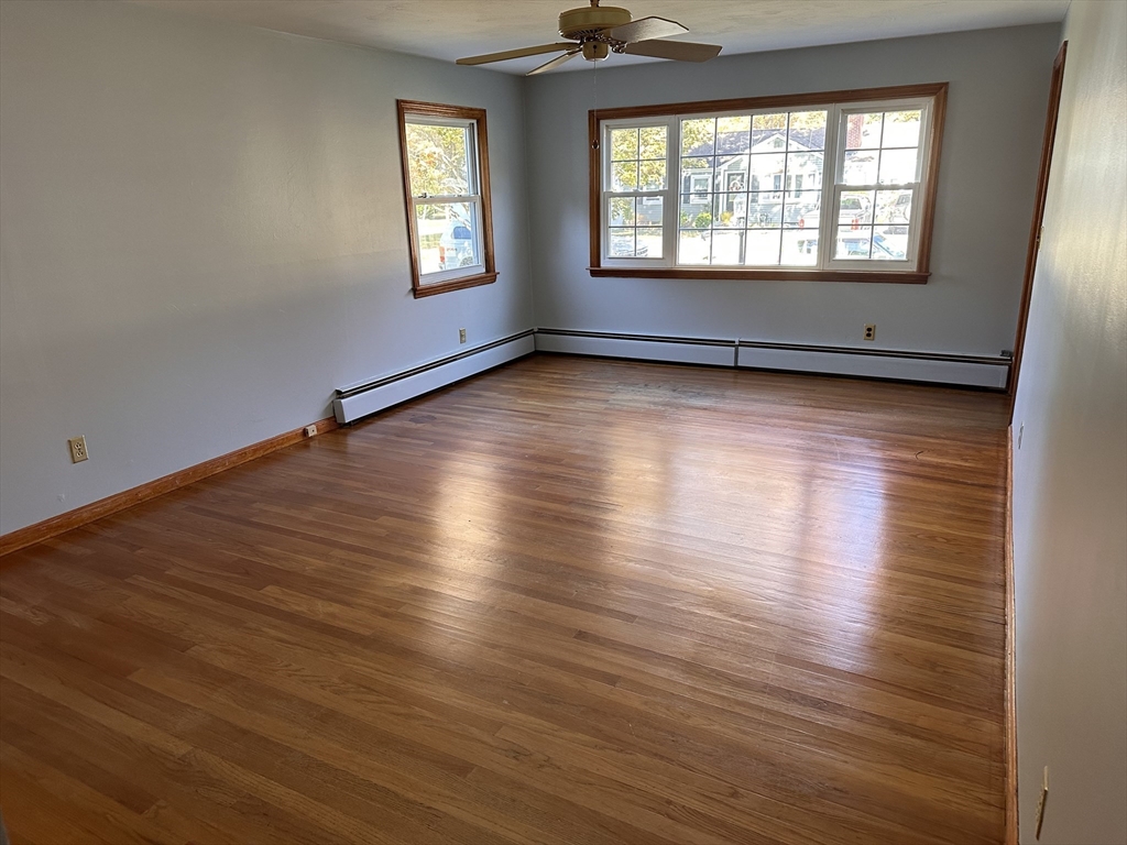 37 Bretton Road Springfield, MA 01119 - Photo 9 of 36 an empty room with wooden floor and windows