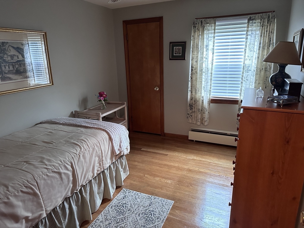 37 Bretton Road Springfield, MA 01119 - Photo 10 of 36 a bed sitting in a bedroom next to a window