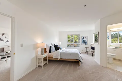 a bed room with a bed and a window