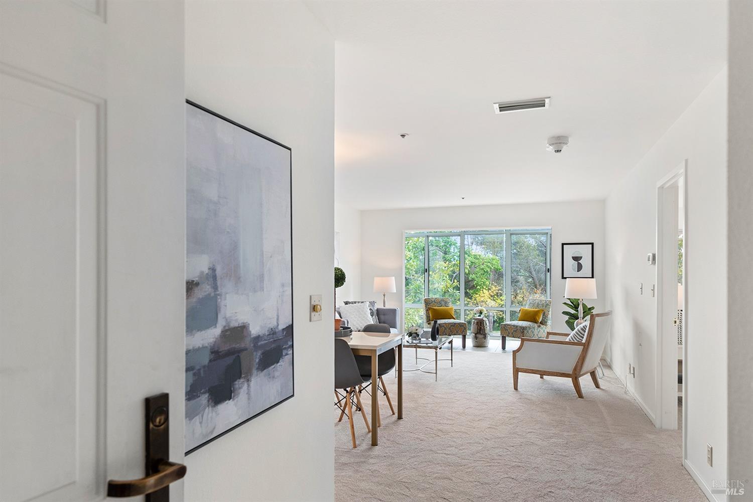 100 Thorndale Drive, Unit 149 San Rafael, CA 94903 - Photo 24 of 38 a living room with furniture and a large window