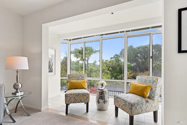 a living room with furniture and a window