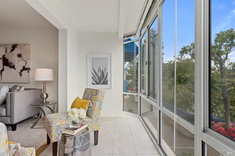 a room with furniture and a potted plant