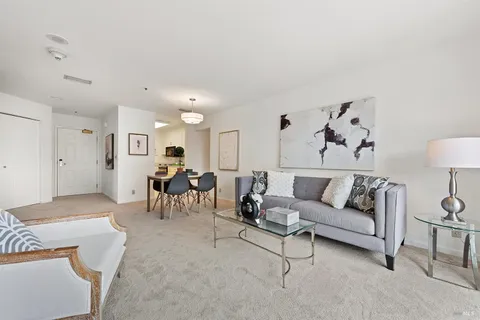 a living room with furniture and a table