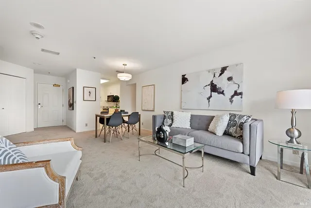 a living room with furniture and a table
