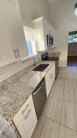 a bathroom with a glass door shower
