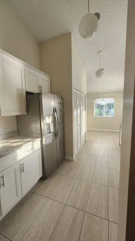 a view of a backyard with sitting area