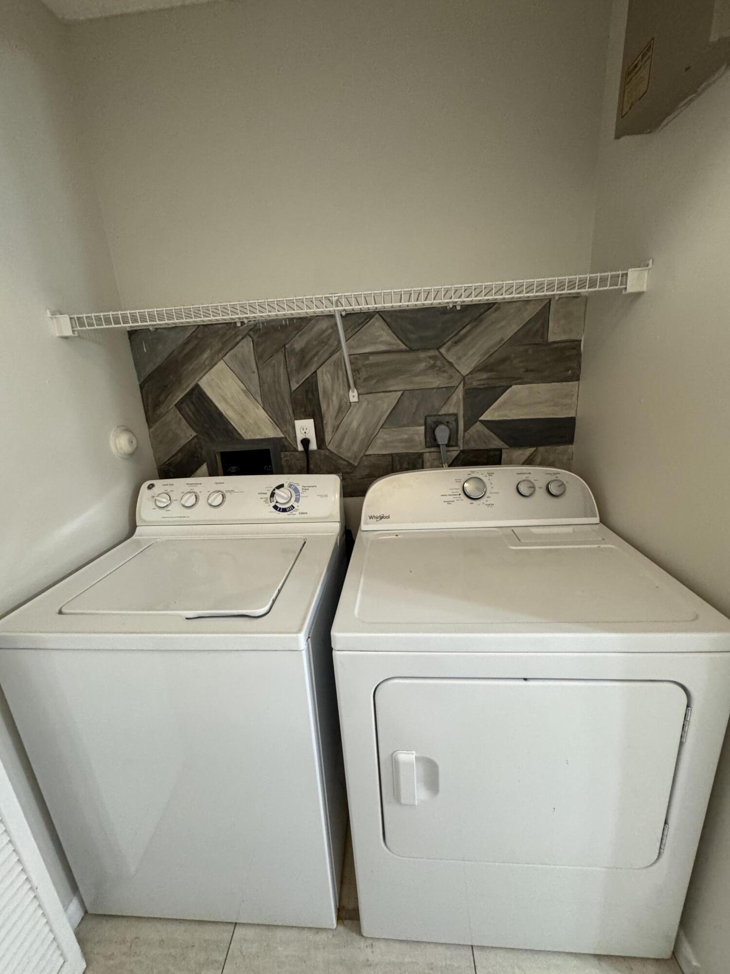 9777 Nickels Boulevard, Unit 705 Boynton Beach, FL 33436 - Photo 14 of 41 a utility room with dryer and washer