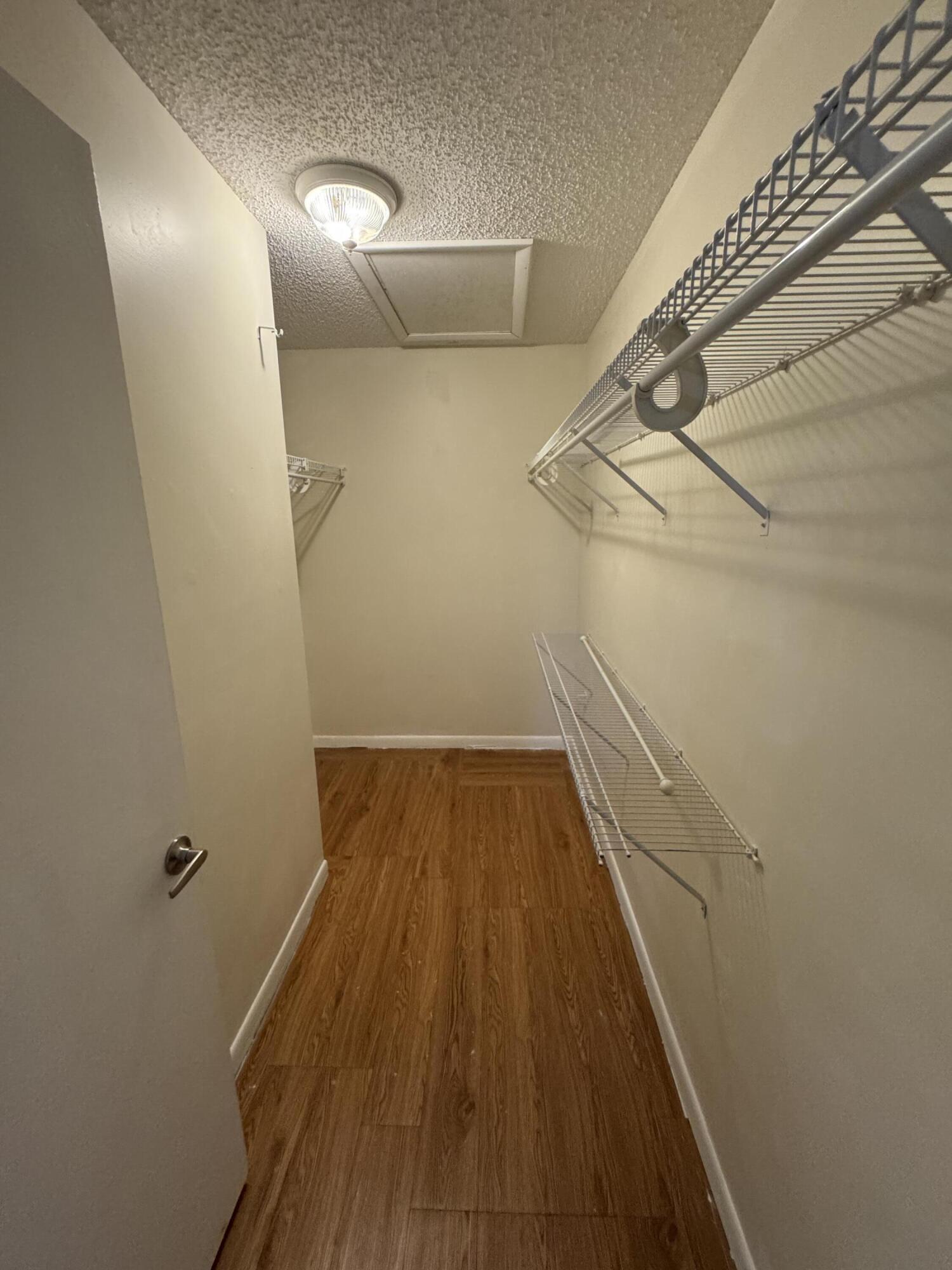 9777 Nickels Boulevard, Unit 705 Boynton Beach, FL 33436 - Photo 25 of 41 a view of a room with racks on the wall