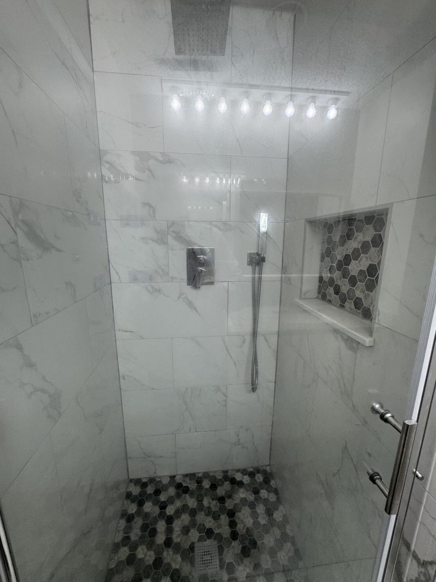 9777 Nickels Boulevard, Unit 705 Boynton Beach, FL 33436 - Photo 29 of 41 a bathroom with a shower