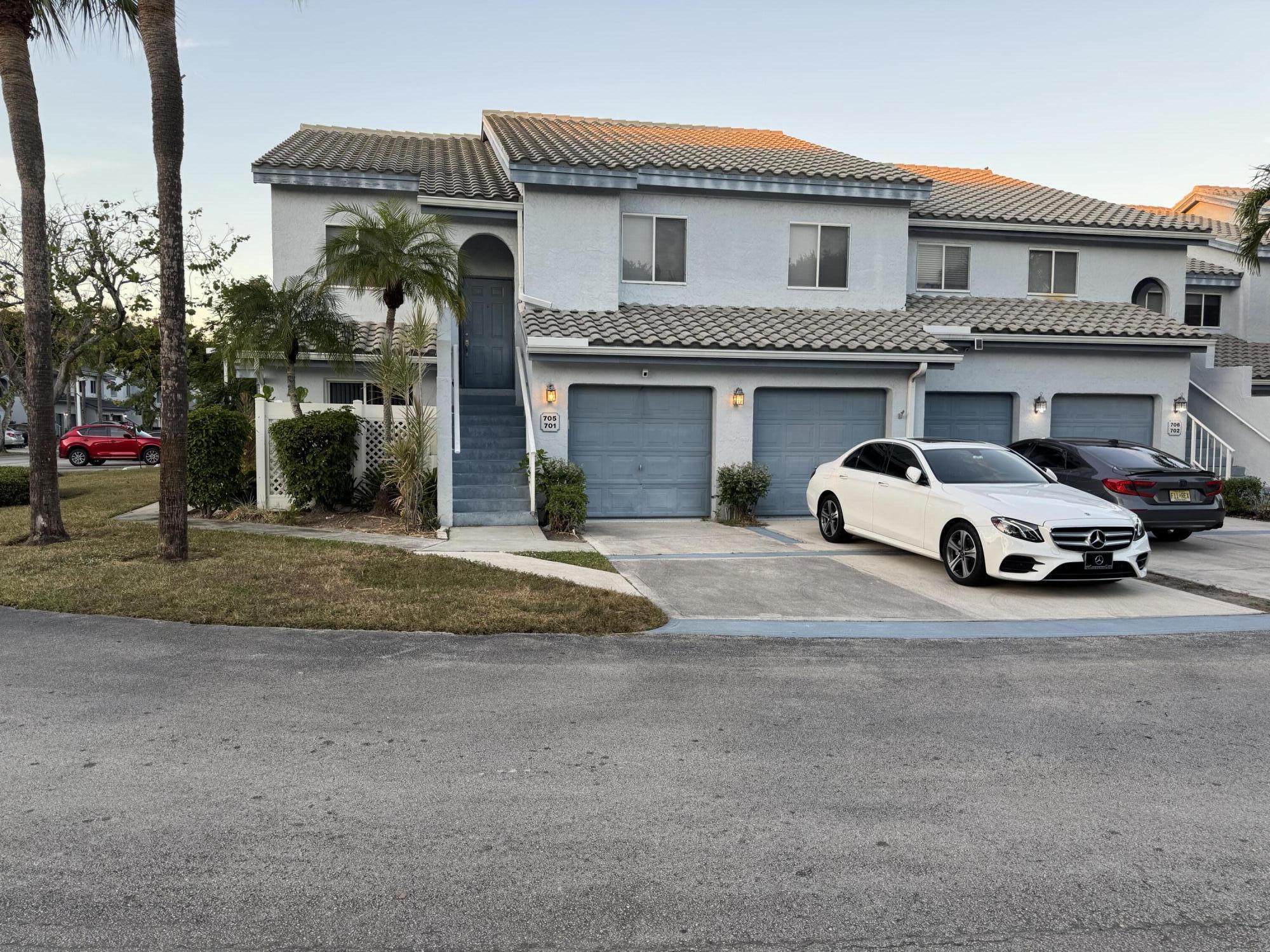 9777 Nickels Boulevard, Unit 705 Boynton Beach, FL 33436 - Photo 3 of 41 a view of a car park front of a building