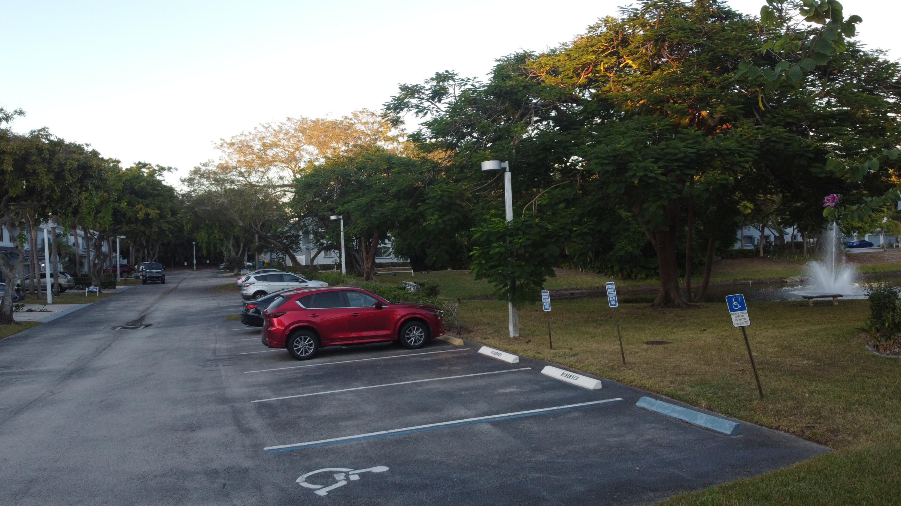 9777 Nickels Boulevard, Unit 705 Boynton Beach, FL 33436 - Photo 38 of 41 a view of a yard with red chairs