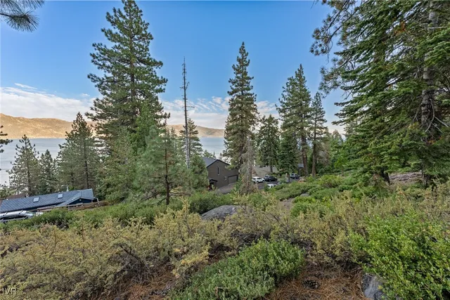 a view of a street with a bench in front of it