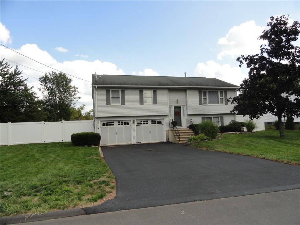 5 Sam Street Enfield, CT 06082 - Photo 1 of 1 a view of a house with a back yard
