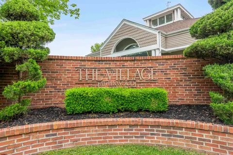 a front view of house with yard and trees