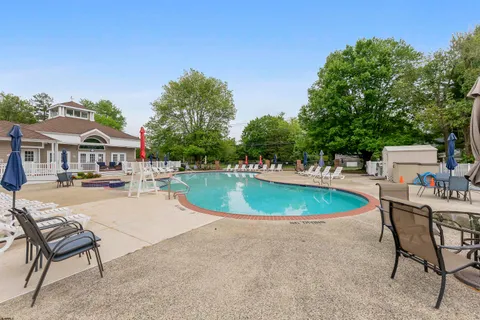 a garden with trees in front of it