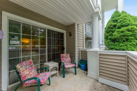 a outdoor living space with furniture and a potted plant