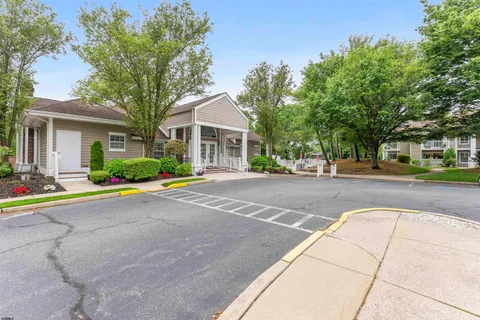 a view of a chair and table in the garden