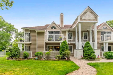 a view of a chair and table in the garden