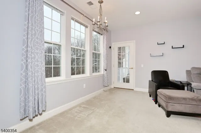 a view of a balcony with wooden floor