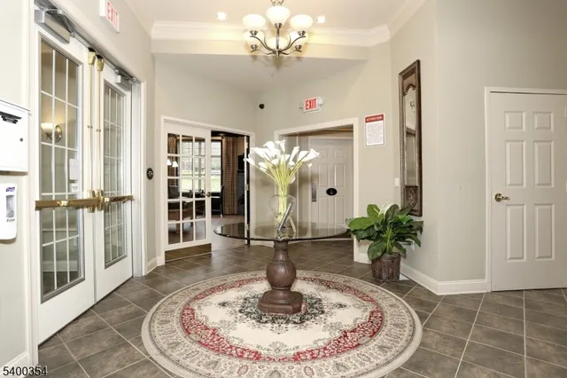 a room with pool table and windows