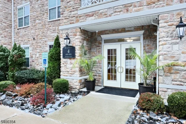 a view of a building with potted plants