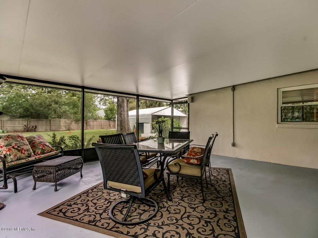 3470 Washburn Road Jacksonville, FL 32250 - Photo 39 of 50 Screen Enclosed Porch at Rear of Home