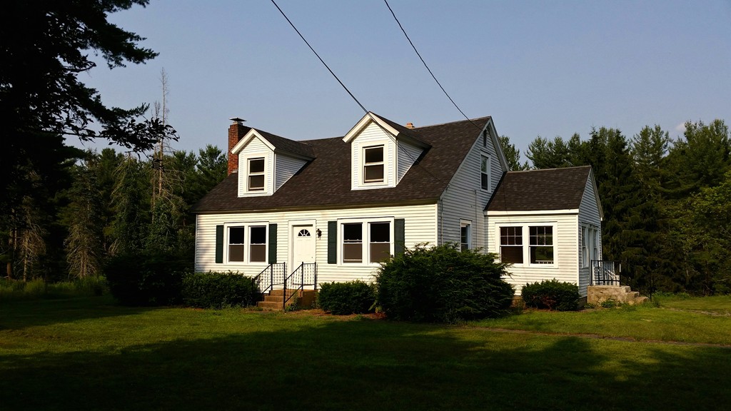 551 Brimfield Road Warren, MA 01083 - Photo 1 of 6 a front view of a house with a yard