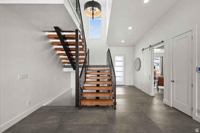 507 West Windmill Gate Cove Draper, UT 84020 - Photo 2 of 46 Entryway with a barn door, recessed lighting, and concrete floors