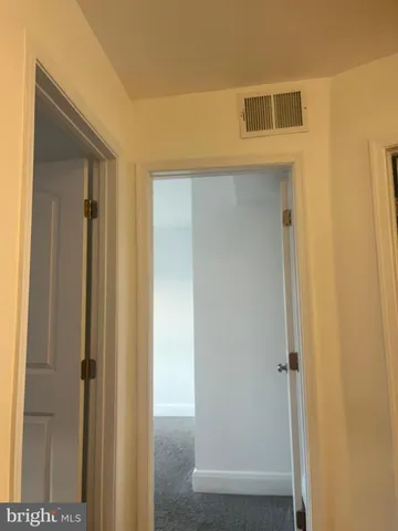 a view of a hallway with closet