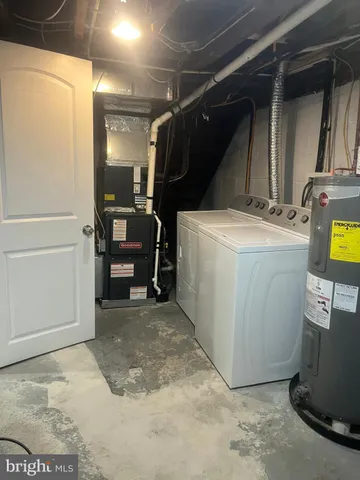 a view of storage and utility room with washer and dryer