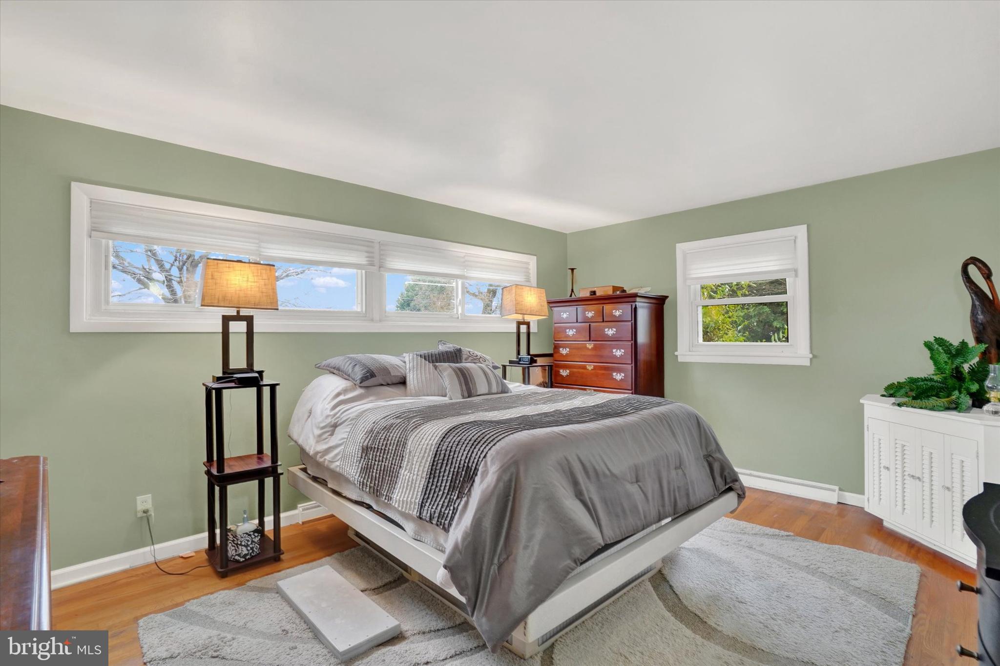 111 Dixie Drive Red Lion, PA 17356 - Photo 14 of 28 a bedroom with a bed and a lamp on the dresser