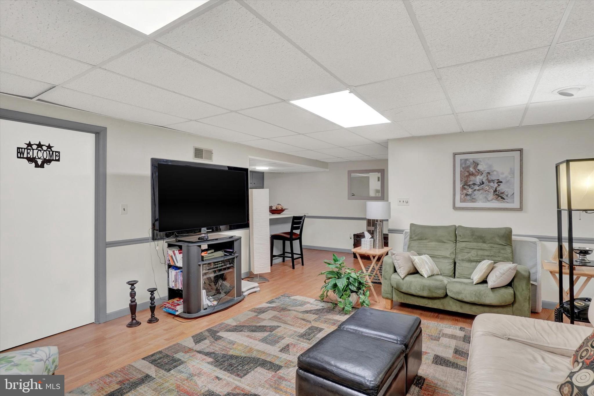 111 Dixie Drive Red Lion, PA 17356 - Photo 23 of 28 a living room with furniture and a flat screen tv