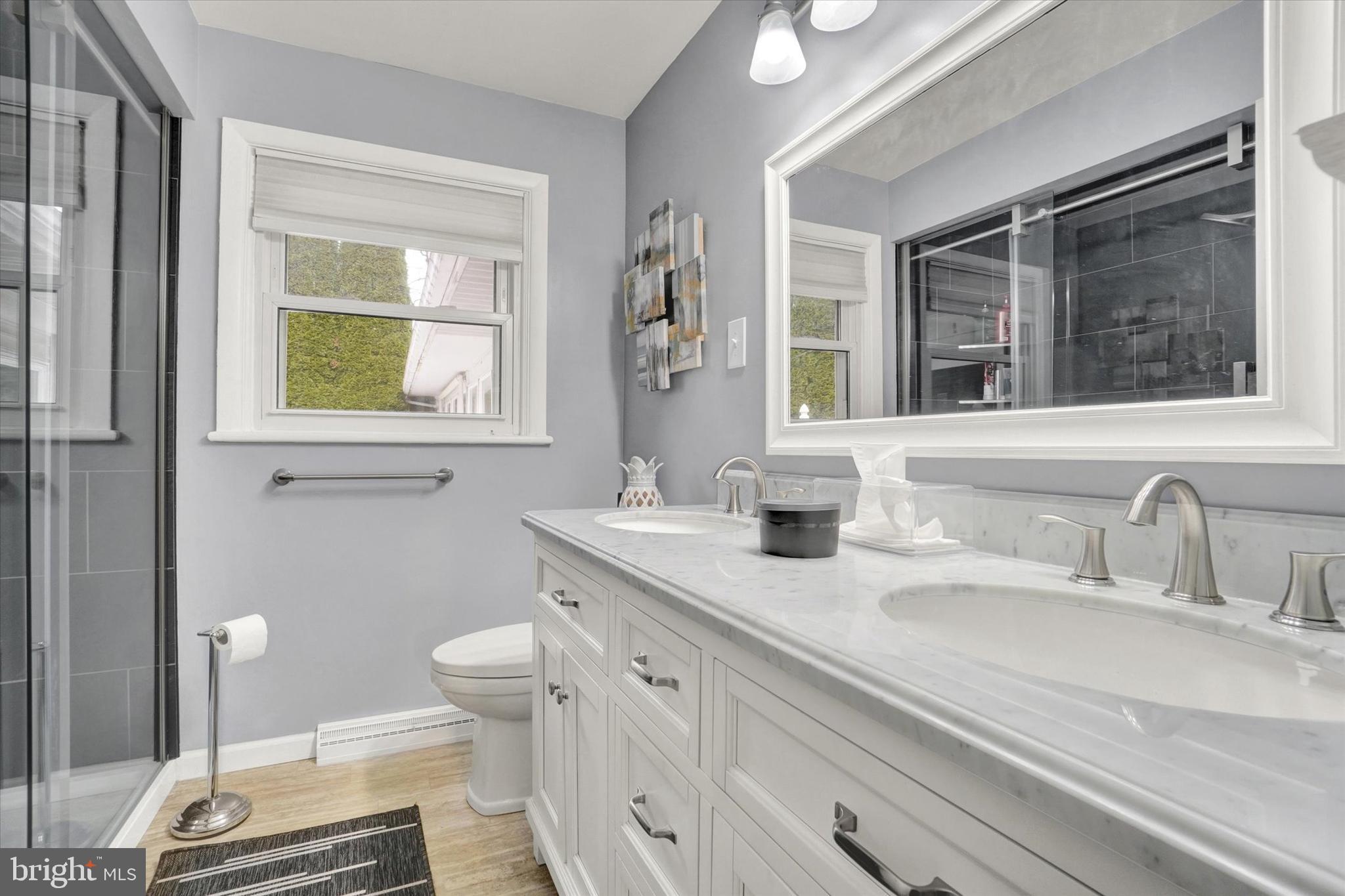 111 Dixie Drive Red Lion, PA 17356 - Photo 10 of 28 a bathroom with a granite countertop sink mirror vanity and toilet