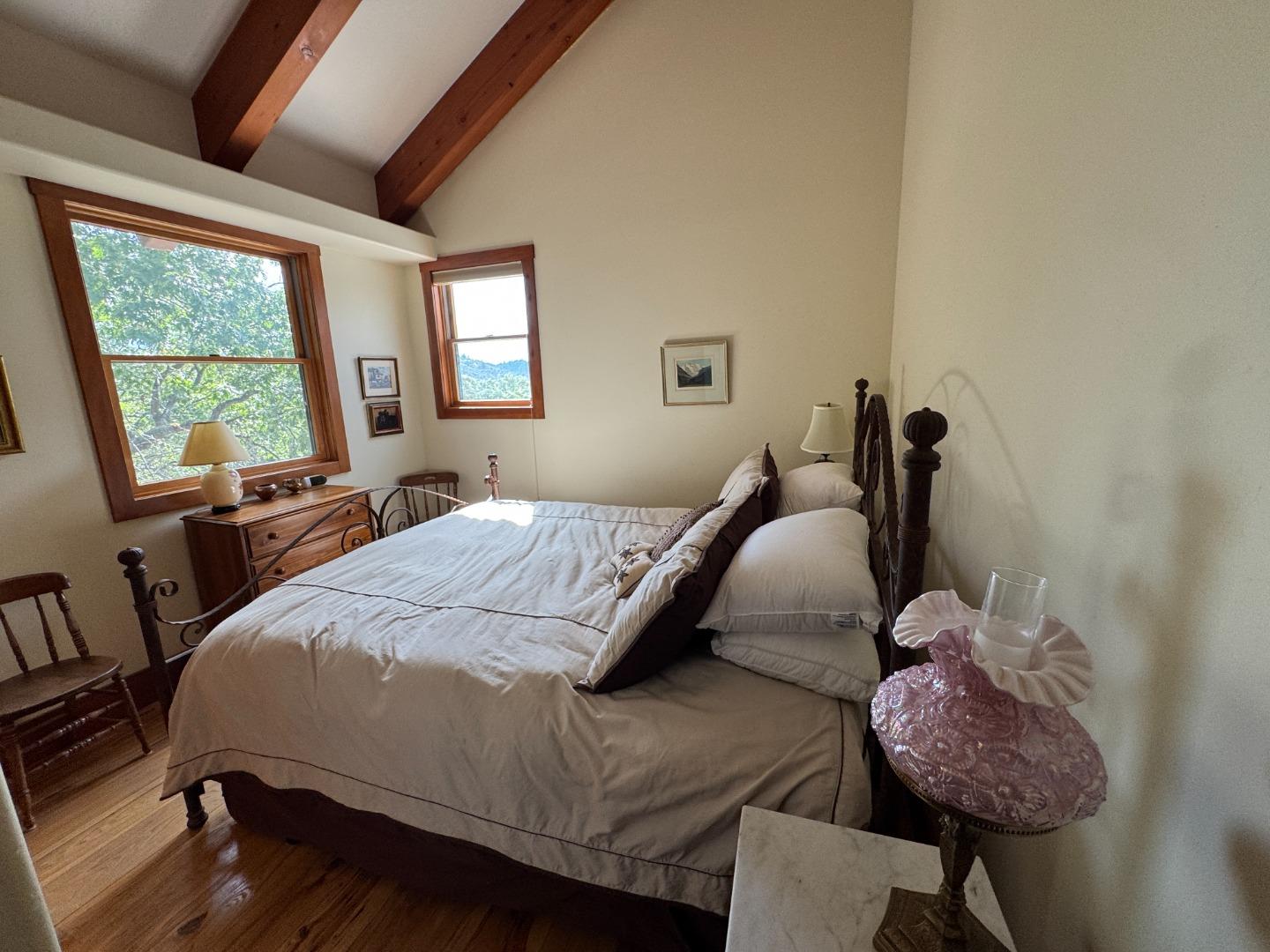 2251 Folendorf Road Murphys, CA 95247 - Photo 11 of 39 a bedroom with a bed window and a chair