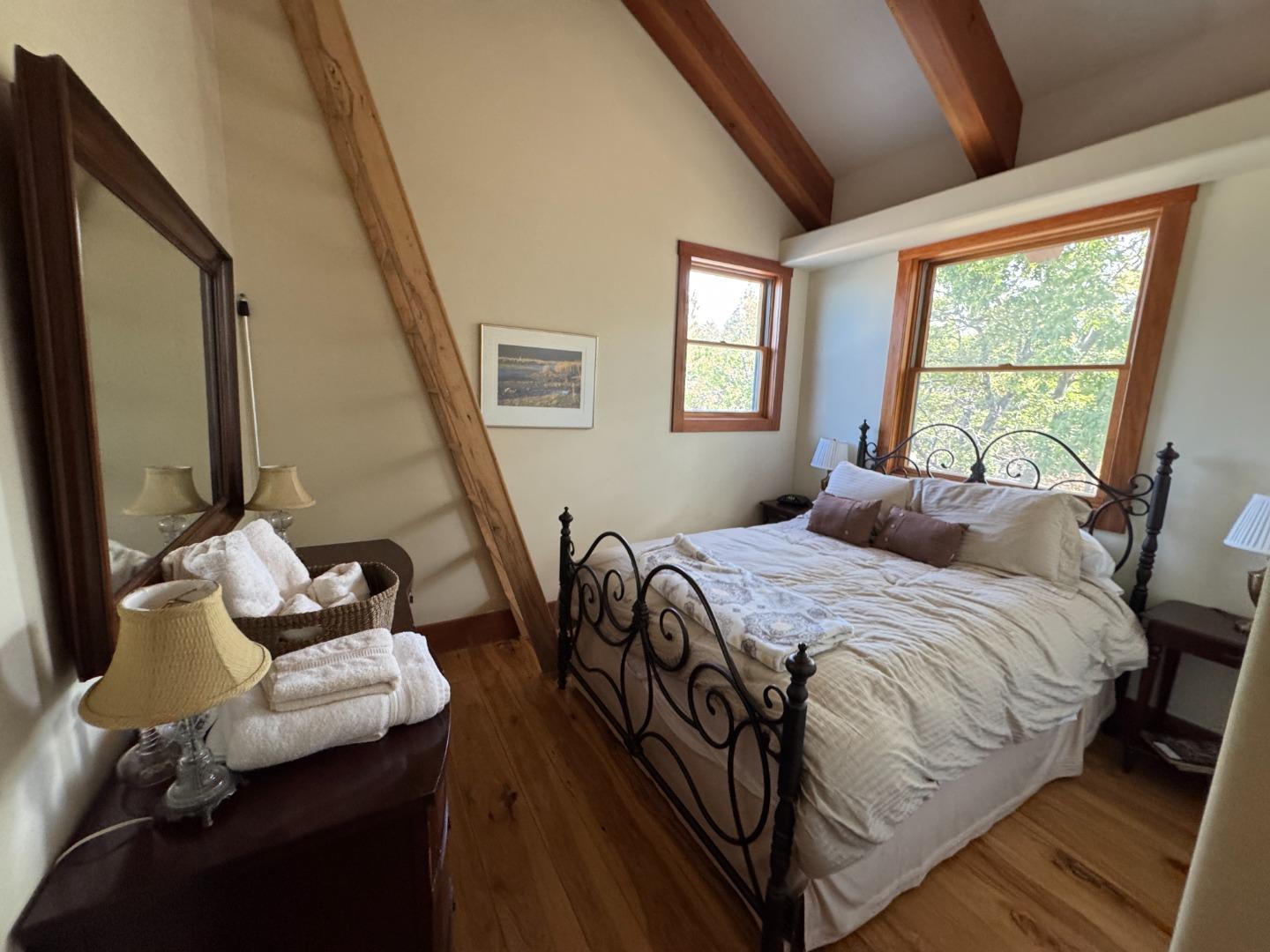 2251 Folendorf Road Murphys, CA 95247 - Photo 12 of 39 a bedroom with a bed and wooden floor
