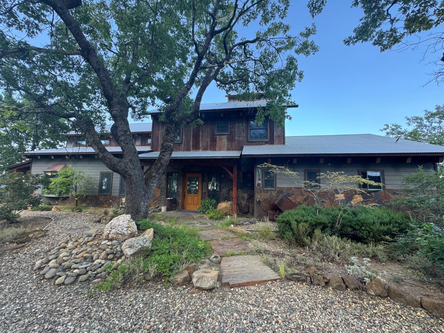 2251 Folendorf Road Murphys, CA 95247 - Photo 2 of 39 a front view of a house with garden