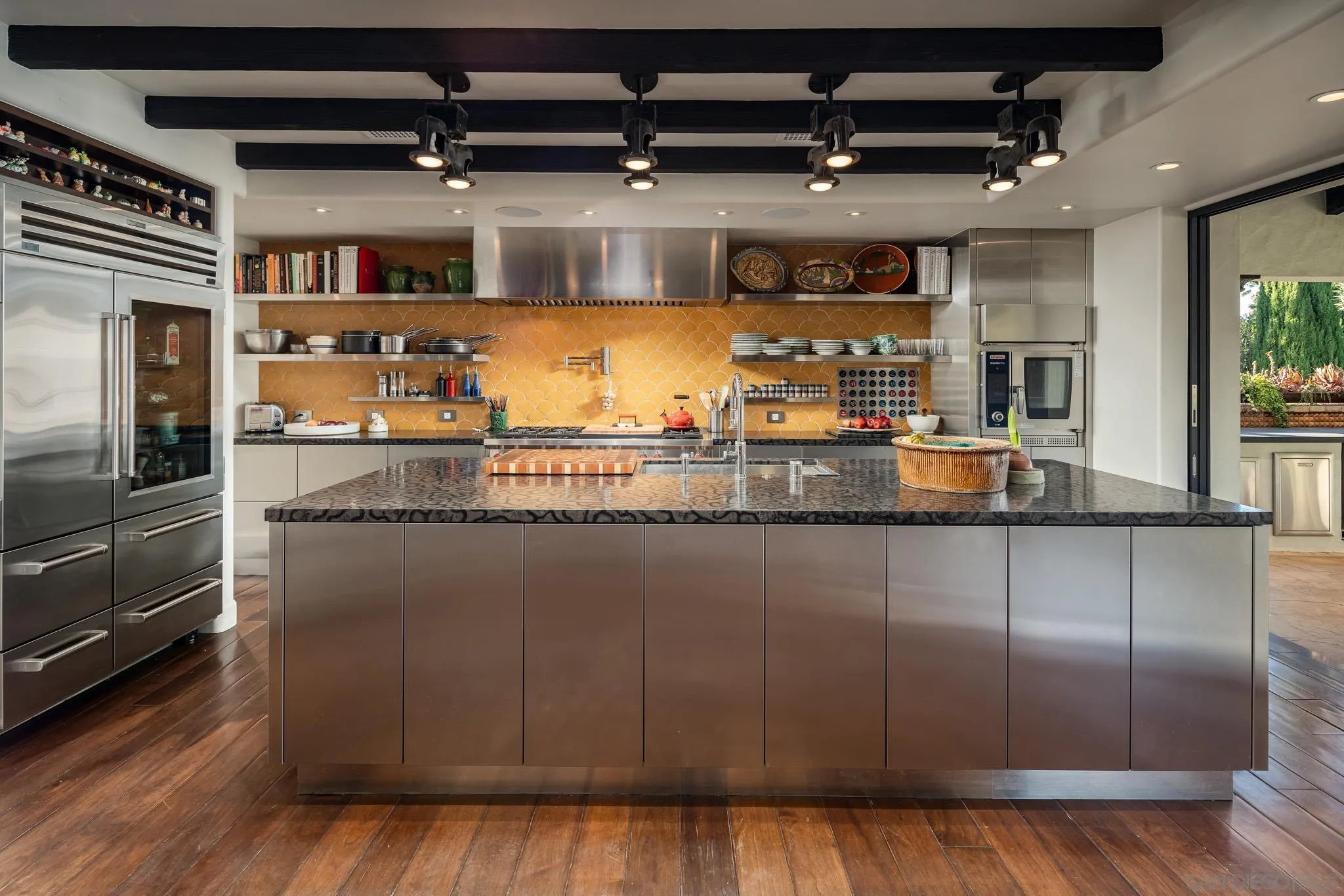 18245 Paseo Victoria Rancho Santa Fe, CA 92067 - Photo 16 of 50 a kitchen with granite countertop a refrigerator and a stove