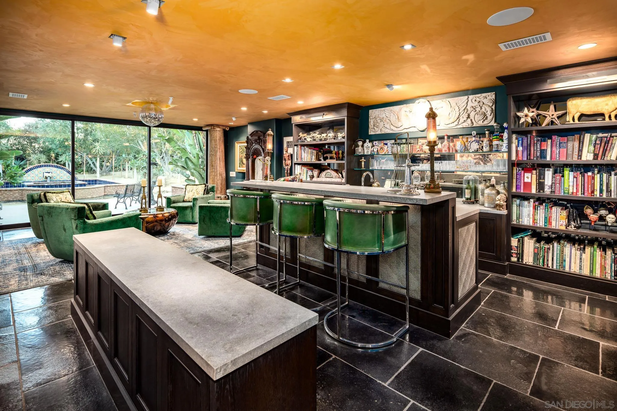 18245 Paseo Victoria Rancho Santa Fe, CA 92067 - Photo 28 of 50 a kitchen with stainless steel appliances granite countertop a table chairs and a large window