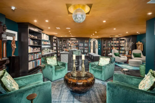 a view of swimming pool with chairs and outdoor seating