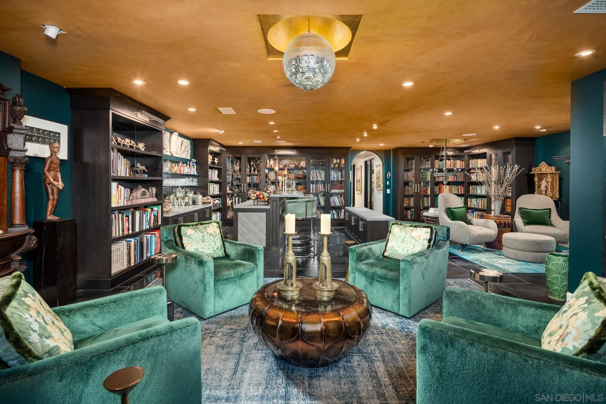 18245 Paseo Victoria Rancho Santa Fe, CA 92067 - Photo 29 of 50 a living room with lots of furniture and a book shelf