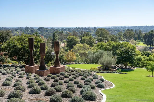 a view of balcony with furniture and palm trees