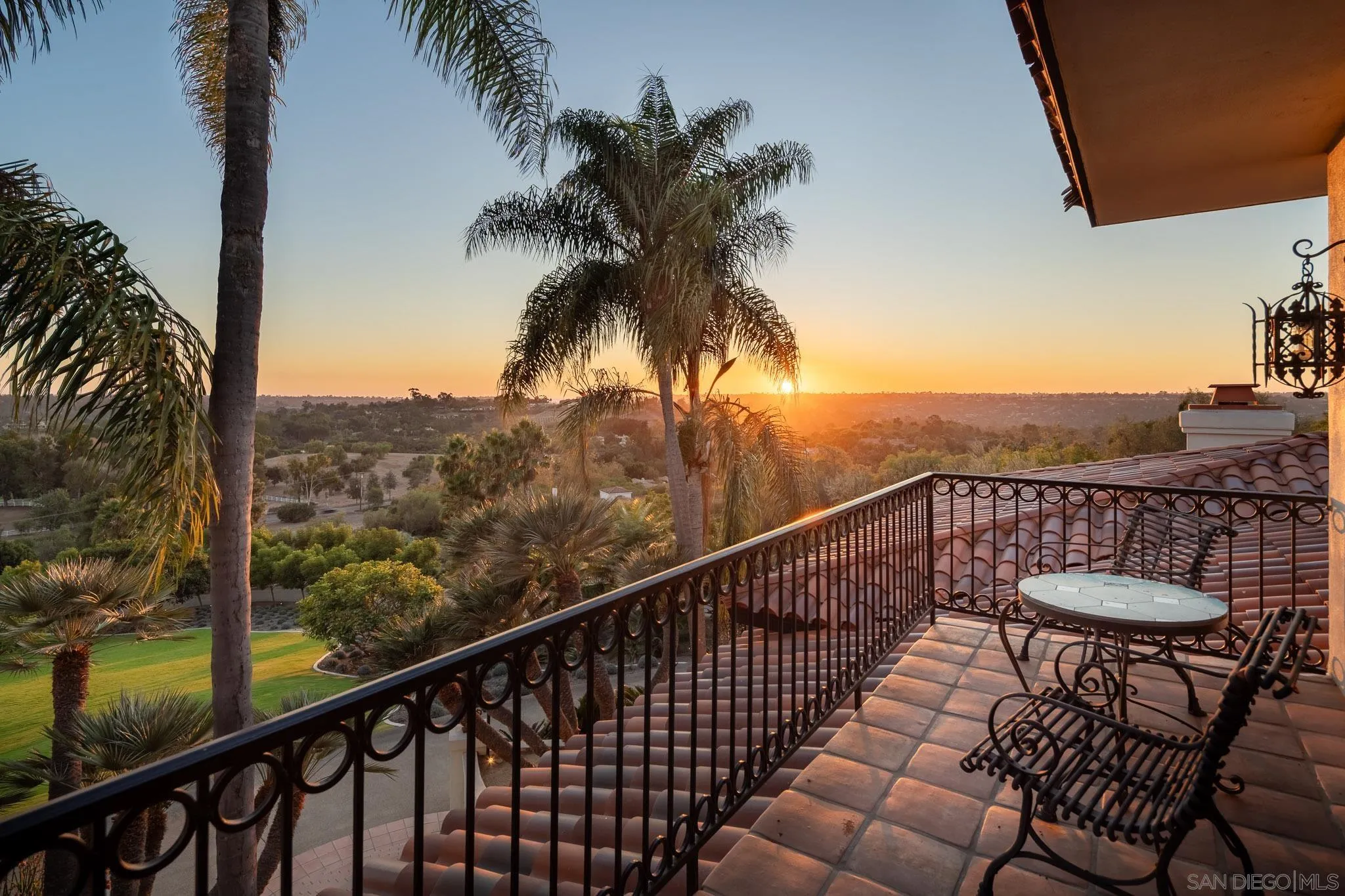 18245 Paseo Victoria Rancho Santa Fe, CA 92067 - Photo 37 of 50 a view of balcony with furniture and palm trees
