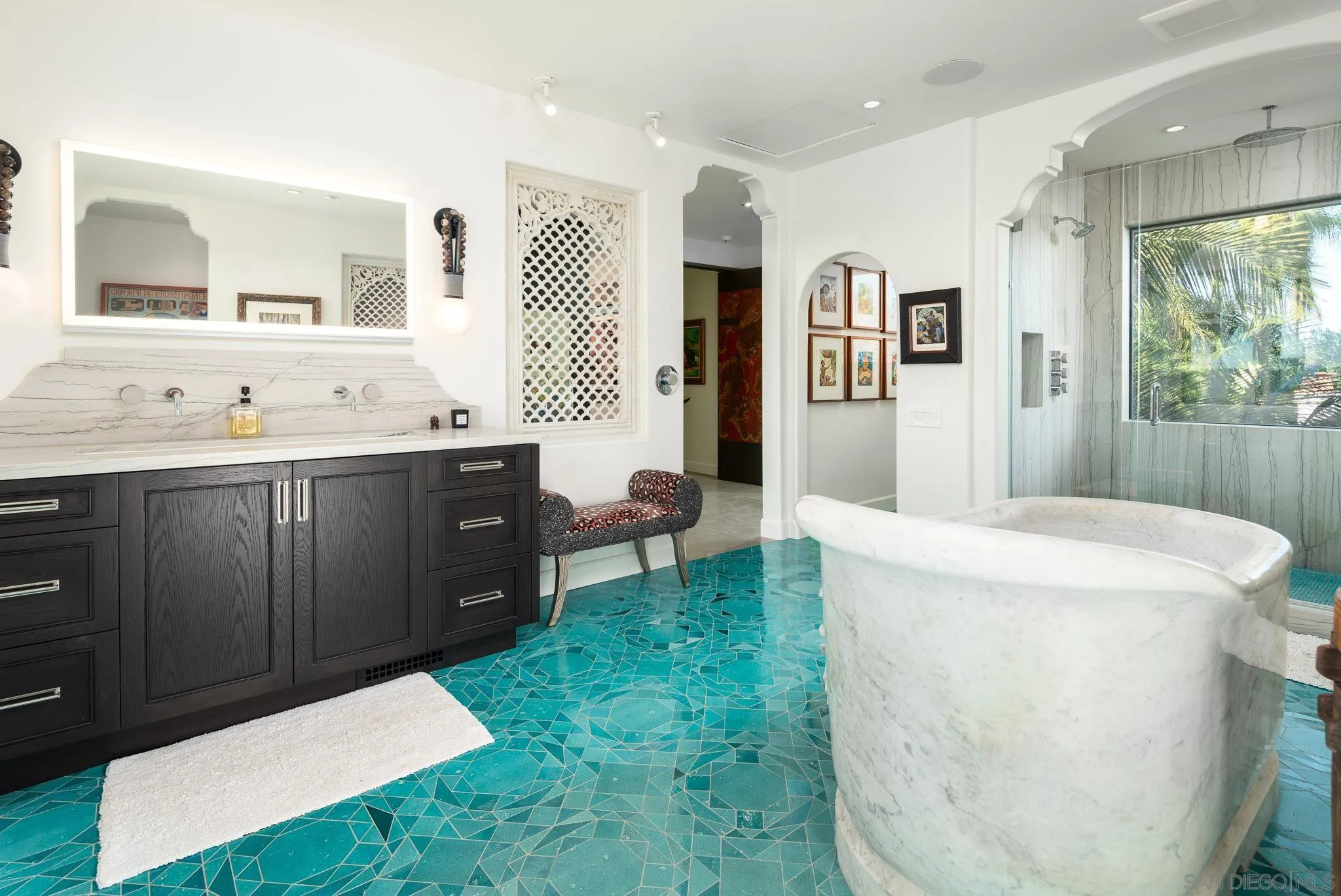 18245 Paseo Victoria Rancho Santa Fe, CA 92067 - Photo 40 of 50 a room with a sink a mirror and a window