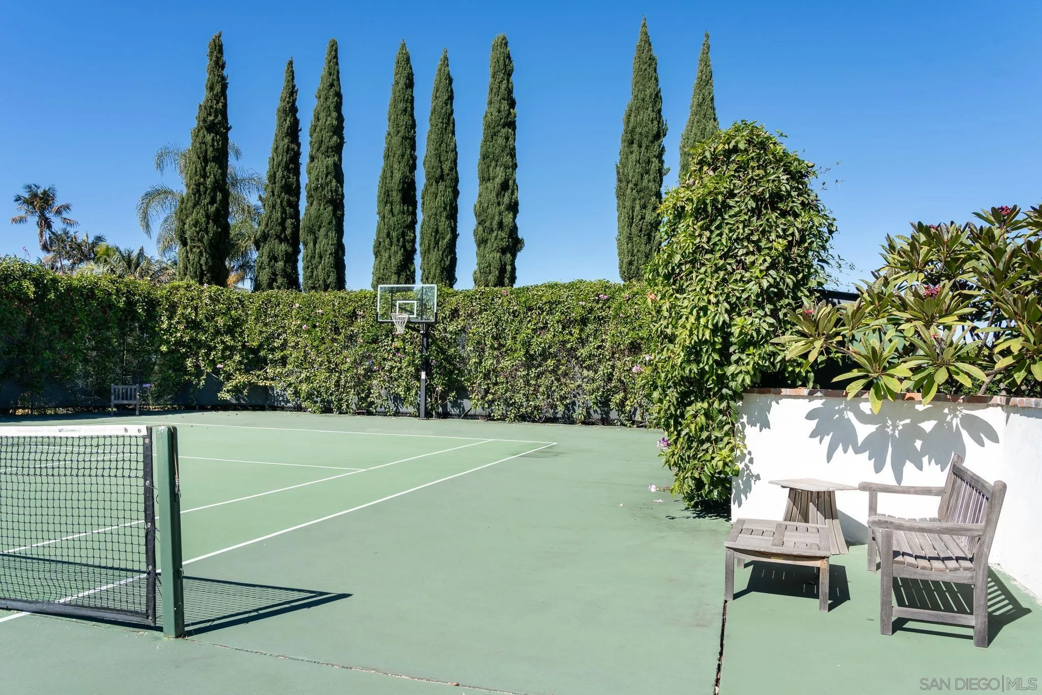 18245 Paseo Victoria Rancho Santa Fe, CA 92067 - Photo 43 of 50 a view of a lawn chairs and table in the backyard