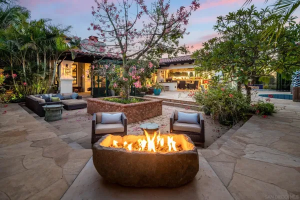 a view of a patio with a table and chairs