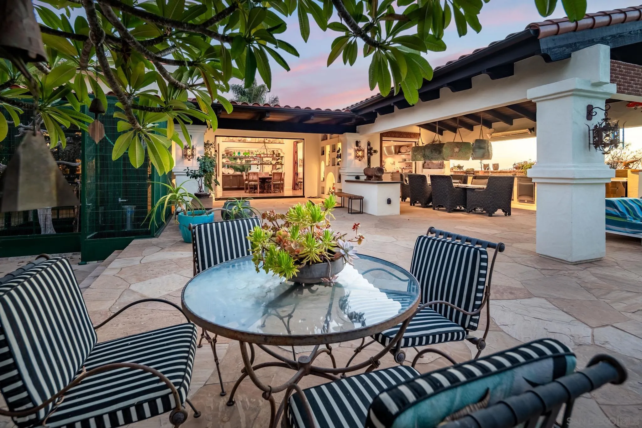 18245 Paseo Victoria Rancho Santa Fe, CA 92067 - Photo 45 of 50 a view of a patio with a table and chairs